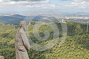 Apostle sculpture of The Sacred Heart of Jesus Church looks on Tibidabo Hill, Mount Tibidabo, Barcelona, Catalonia, Spain photo