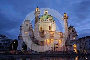 Church of Saint Charles (Karlskirche) at blue hour in Resselpark, Vienna, Austria. Illuminated landmark building