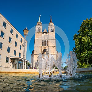 Church of Saint Jochannis Jochanniskirche and fountain in the garden, Magdeburg, Germany, sunny day, summer time, blue sky