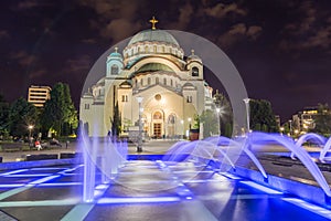 Church of Saint Sava at night with colourful fountains