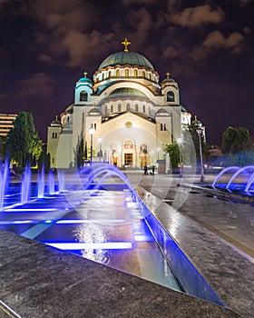 Church of Saint Sava at night with colourful fountains