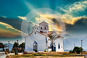 Church of Saint Spyridon in Elafonisos in Greece against a dramatic sky.