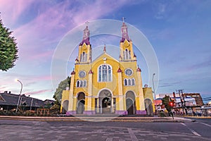 Church of San Francisco at Plaza de Armas Square at sunset - Castro, Chiloe Island, Chile photo