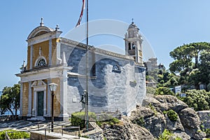 The church of San Giorgio in Portofino with a castle in background