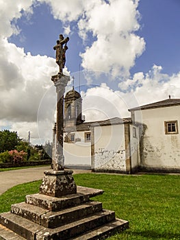 The church of San Salvador and its cruceiro photo