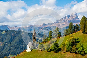 Church of Santa Barbara during the day in the cozy little village of La Valle, Alta Badia, South Tyrol