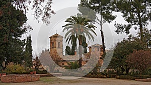 Church of Santa Maria de Alhambra, in Jardins del Paraiso garden, Granada, Spain, on a cloudy day
