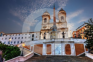 Church of the Santissima Trinita dei Monti in Piazza di Spagna under the clouds