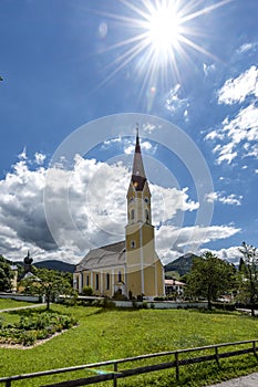 Church at Schliersee in Bavaria Germany with sun and blue sky