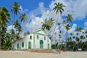 Church by the sea with coconut plantation located on Carneiros beach- Brazil