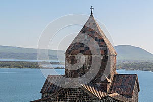 church of sevanavank in armenia against the backdrop of lake of sevan and sky
