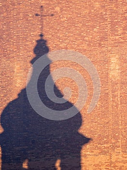 Church shadow on a brick wall