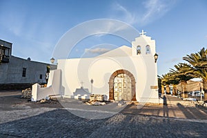 Church in small village of Femes in late afternoon photo