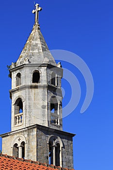 Church spire and terracotta roof photo