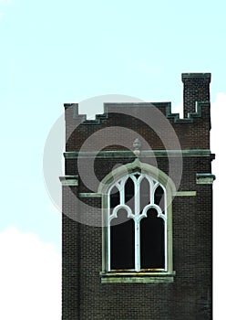 Church square brick bell tower with gothic window
