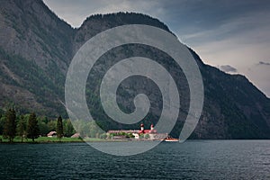 Church St. Bartholomä at lake Königssee with Watzmann mountain cliffs at Berchtesgaden Bavaria