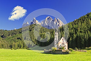 The church St. Johann in Ranui in the Villnoess / Funes valley in the Dolomites, South Tyrol, Italy
