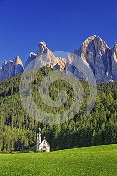 The church St. Johann in Ranui in the Villnoess / Funes valley in the Dolomites, South Tyrol, Italy