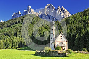 The church St. Johann in Ranui in the Villnoess / Funes valley in the Dolomites, South Tyrol, Italy photo