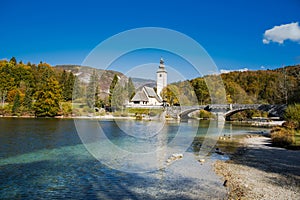 Church of St. John the Baptist and stone bridge in Ribcev Laz, lake Bohijn,Slovenia