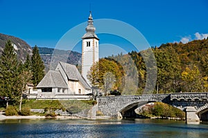 Church of St. John the Baptist and stone bridge in Ribcev Laz, lake Bohijn,Slovenia