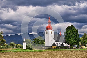 Church of St. Ladislav in Liptovske Matiasovce in front of Chocske vrchy