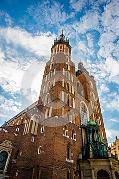 Church of St. Mary and the Cloth Hall in the main Market Square -Rynek Glowny in the city of Krakow in Poland