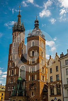 Church of St. Mary and the Cloth Hall in the main Market Square -Rynek Glowny in the city of Krakow in Poland