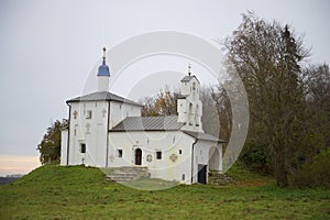 The Church of St. Nicholas on the Truvor mound in the autumn dusk. Izborsk