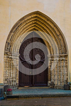 Church of St. Olaf. Old door with decor in the old town. Tallinn. Estonia