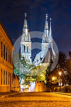 Church of St. Peter and Paul on Vysehrad. Cobbled street by night. Prague, Czech Republic