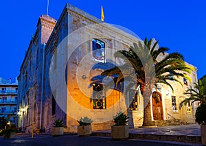 The Church of St Titus, or Agios Titos, in centre of Heraklion, Crete, at night with an almost full moon above it.