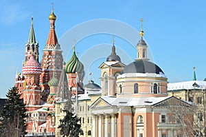 The church of St. Varvara and St. Basil`s Cathedral in sunny winter day. Street Varvarka. Moscow, Russia