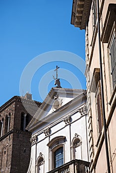 Church with a stags head over the facade in Rome Italy that has books as the main theme
