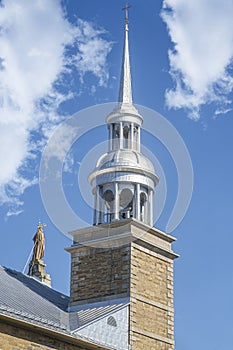 Church steeple with clouds in St-Rose Laval