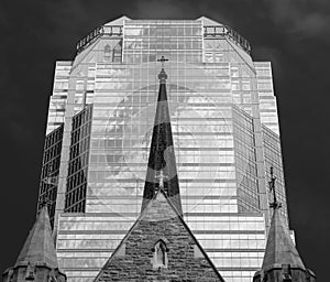 Church steeple in front of stylish modern office building