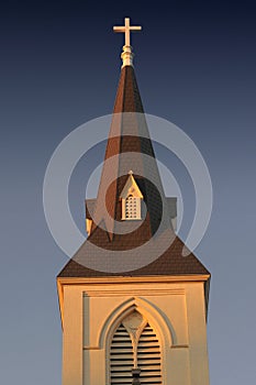 Church Steeple in setting sunlight photo