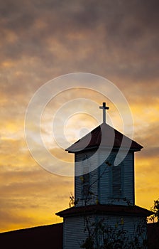Church steeple silhouette at sunset
