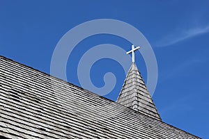 Church Steeple and Wood Shingle Roof with a Cross