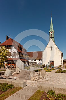 Church and stone's monument on the Bodensee embankment in Unteruhldingen