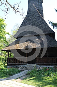 Church with thatched roof in Dimitrie Gusti National Village Museum in Bucharest