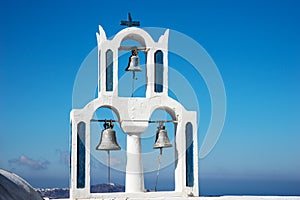 Church with three bells in the town of Fira Santorini