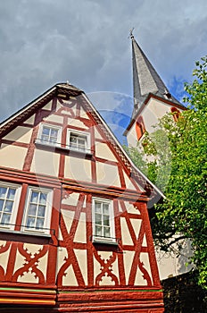 Church and timbered house in the village of Traben-Trarbach - Moselle valley wine region in Germany