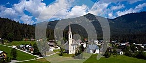 Church on top of hill near beautiful mountains view