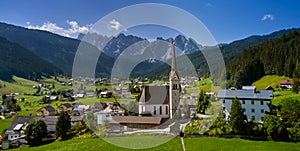 Church on top of hill near beautiful mountains view