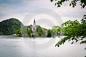 Church with the towen on the island at lake Bled, Slovenia photo