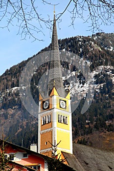 Church tower in Alpine village Bad Hofgastein , Austria.