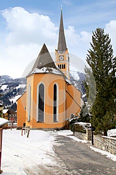 Church tower in Alpine village Bad Hofgastein , Austria.