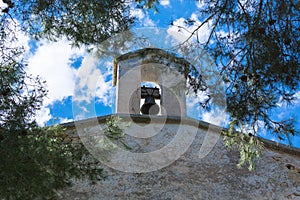 Church tower with bell in Spanish style