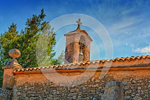 Church tower with bell in Spanish style